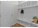 Organized mudroom with built-in storage, hooks, and bench seating for easy entry and exit, very functional at 1052 Harlow'S Crossing Dr, Weddington, NC 28104