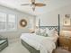 Calm primary bedroom featuring neutral tones, and natural light from the shuttered windows at 1123 Park West Dr, Charlotte, NC 28209