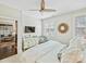 Bright bedroom with white walls, natural light, and a glimpse into the inviting living area at 1123 Park West Dr, Charlotte, NC 28209