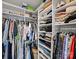 Bright walk-in closet with ample shelving, hanging racks, and organized storage for clothing, shoes, and accessories at 1123 Park West Dr, Charlotte, NC 28209