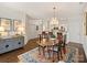 Well-lit dining space connecting to an open floor plan that shows the kitchen and living area at 1123 Park West Dr, Charlotte, NC 28209