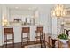 Stylish dining room showcasing an elegant chandelier and seamless open-concept access to the kitchen at 1123 Park West Dr, Charlotte, NC 28209