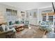 Bright living room with large windows, neutral tones, and comfortable seating arrangements at 1123 Park West Dr, Charlotte, NC 28209