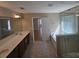 Bathroom featuring a glass shower, soaking tub, and double vanity at 11922 Kimberfield Rd # 37, Matthews, NC 28105