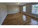 Bright bedroom features hardwood floors and large windows at 11922 Kimberfield Rd # 37, Matthews, NC 28105