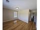 Bright bedroom with hardwood floors and natural light from the window at 11922 Kimberfield Rd # 37, Matthews, NC 28105