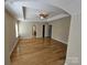 Primary bedroom featuring hardwood floors, a tray ceiling, and a ceiling fan at 11922 Kimberfield Rd # 37, Matthews, NC 28105