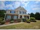 Charming two-story home with a combination of stone and siding, complemented by manicured landscaping at 11922 Kimberfield Rd # 37, Matthews, NC 28105