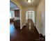 Spacious foyer showcasing hardwood floors and arched doorways leading to other rooms at 11922 Kimberfield Rd # 37, Matthews, NC 28105