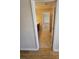 Hallway entrance to the bathroom featuring tile floors and neutral walls at 11922 Kimberfield Rd # 37, Matthews, NC 28105
