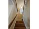 Staircase with wood steps, a wood handrail, and white trim at 11922 Kimberfield Rd # 37, Matthews, NC 28105
