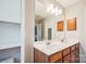 Bathroom features a large mirror, double vanity, and modern lighting at 12027 Stratfield Place Cir, Pineville, NC 28134