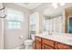Well-lit bathroom featuring double sinks, modern vanity, and plenty of storage space at 12027 Stratfield Place Cir, Pineville, NC 28134