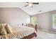 Bright bedroom with a vaulted ceiling, ceiling fan, and ample natural light at 12027 Stratfield Place Cir, Pineville, NC 28134