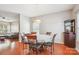 Cozy dining area features wood floors, modern lighting, and seamlessly connects to a comfortable living space at 12027 Stratfield Place Cir, Pineville, NC 28134