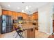 Well-equipped kitchen featuring granite countertops, stainless steel appliances, and a functional center island at 12027 Stratfield Place Cir, Pineville, NC 28134