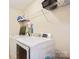 Laundry room features updated appliances, a wire shelf and storage at 12027 Stratfield Place Cir, Pineville, NC 28134
