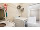 Laundry room includes washer and dryer with shelving for storage at 12027 Stratfield Place Cir, Pineville, NC 28134