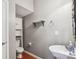 Powder room features wood flooring, toilet and storage cabinet at 12027 Stratfield Place Cir, Pineville, NC 28134