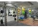 Community gym features weightlifting equipment, mirrors, and padded flooring for a comfortable workout space at 127 N Tryon St # 301, Charlotte, NC 28202