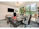 Office featuring a large desk, comfortable seating, and large windows providing natural light and city views at 127 N Tryon St # 301, Charlotte, NC 28202