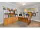 Office featuring built-in shelving, natural light from the windows, and neutral tones at 127 N Tryon St # 301, Charlotte, NC 28202