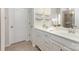 Bright bathroom featuring double sinks, white cabinetry, and modern fixtures at 1313 Loggerhead Dr, Lancaster, SC 29720