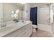 Bright bathroom features a double sink vanity, decorative fish wall decor and shower-tub combination at 1313 Loggerhead Dr, Lancaster, SC 29720