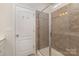 Stylish bathroom featuring a tiled shower with glass door and modern fixtures at 1313 Loggerhead Dr, Lancaster, SC 29720