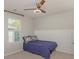 Cozy bedroom with a single bed, ceiling fan, and wainscoting detail on the wall at 1313 Loggerhead Dr, Lancaster, SC 29720