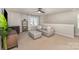 Comfortable bonus room with neutral colors, plush seating, and bright natural light at 1313 Loggerhead Dr, Lancaster, SC 29720