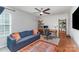Inviting bonus room with a sofa, desk, and built in shelves with office decor at 1313 Loggerhead Dr, Lancaster, SC 29720