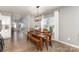 Well-lit dining area features hardwood floors, modern light fixture, and large window at 1313 Loggerhead Dr, Lancaster, SC 29720