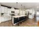 Spacious kitchen featuring white cabinets, stainless steel appliances, and center island with seating at 1313 Loggerhead Dr, Lancaster, SC 29720