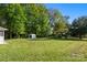 Large, grassy backyard with mature trees and shed at 1325 Red Oaks Dr, Rock Hill, SC 29730