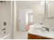 Bathroom with double sinks, wood cabinets, bright lighting, and a full tub/shower at 1325 Red Oaks Dr, Rock Hill, SC 29730