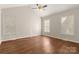 Bright, empty bedroom with ample natural light, wood floors, and a vaulted ceiling at 1325 Red Oaks Dr, Rock Hill, SC 29730