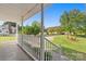 Inviting covered porch with white railings and lush greenery, perfect for relaxing outdoors at 1325 Red Oaks Dr, Rock Hill, SC 29730