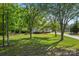 Traditional home featuring a well-manicured lawn, shade trees, and a quaint covered porch at 1325 Red Oaks Dr, Rock Hill, SC 29730