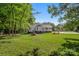 Traditional home featuring a well-manicured lawn, shade trees, and a quaint covered porch at 1325 Red Oaks Dr, Rock Hill, SC 29730