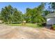 Front view of home featuring a large yard and mature trees at 1325 Red Oaks Dr, Rock Hill, SC 29730