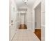 Hallway with tile and wood flooring leading to the home's various rooms and bathroom at 1325 Red Oaks Dr, Rock Hill, SC 29730
