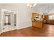Spacious dining area with wood floors, adjacent to a kitchen with wood cabinetry at 1325 Red Oaks Dr, Rock Hill, SC 29730