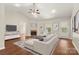 Spacious living room features a fireplace, large sectional sofa, and ample natural light, creating an inviting atmosphere at 1325 Red Oaks Dr, Rock Hill, SC 29730
