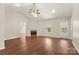 An airy living room featuring a fireplace, natural lighting, and wood flooring for a cozy and inviting atmosphere at 1325 Red Oaks Dr, Rock Hill, SC 29730