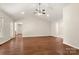 Bright living room features a vaulted ceiling, ceiling fan, and warm wood flooring at 1325 Red Oaks Dr, Rock Hill, SC 29730