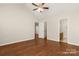 Spacious main bedroom with attached bathroom, wood floors, and ceiling fan at 1325 Red Oaks Dr, Rock Hill, SC 29730