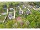 An aerial view of the house in a neighborhood setting surrounded by lush greenery and trees at 137 Brawley Woods Ln, Mooresville, NC 28115