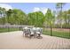 Inviting back deck area furnished with a dining table and seating, perfect for outdoor dining at 137 Brawley Woods Ln, Mooresville, NC 28115