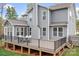 Expansive backyard deck with black railings and ample space for outdoor dining and entertaining at 137 Brawley Woods Ln, Mooresville, NC 28115